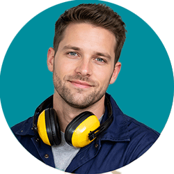 Man with hearing protection and blue jumpsuit