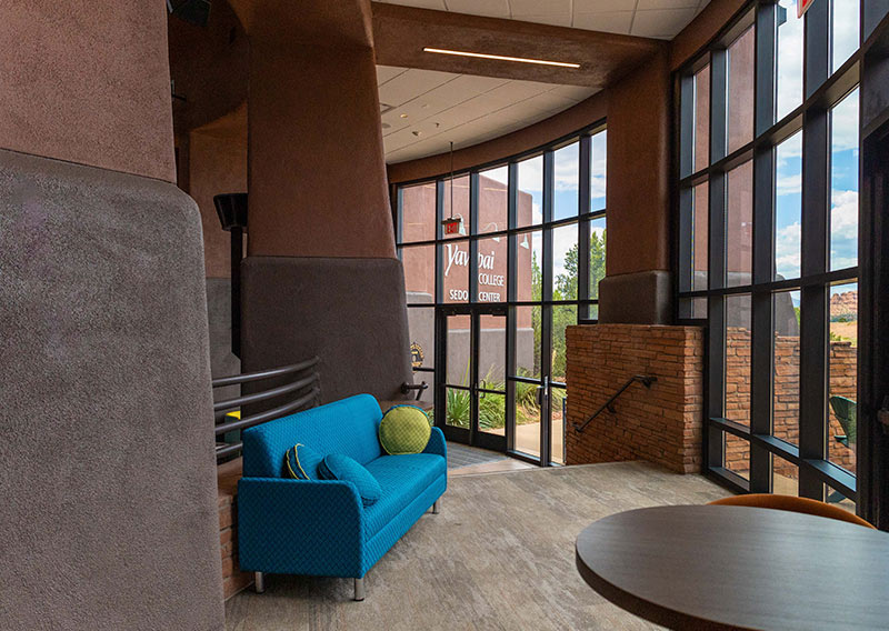 Lounge seating beside floor-to-ceiling windows at the Sedona Center