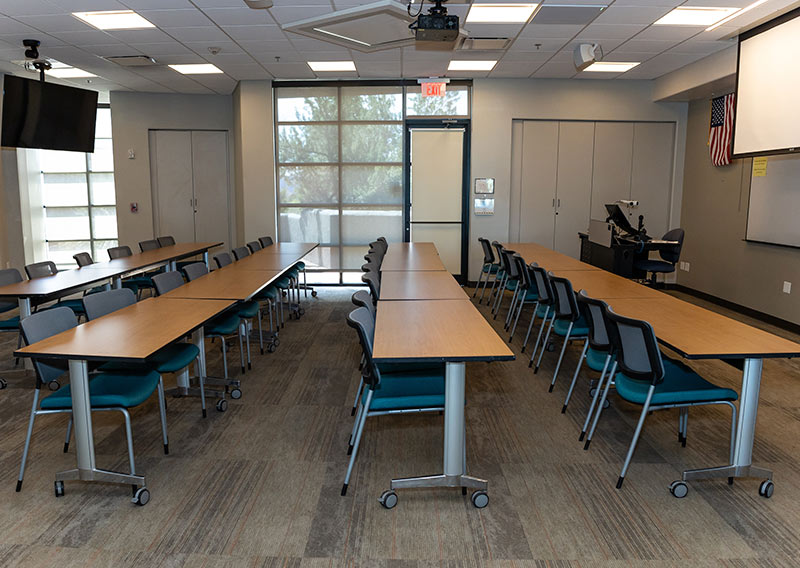 Sedona Center meeting room arranged with tables in a U shape