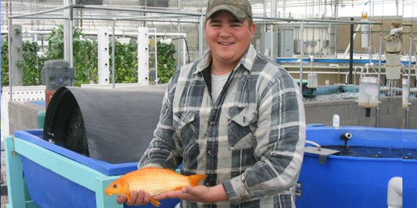 Student holding fish
