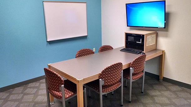 study room with table, four chairs, and computer