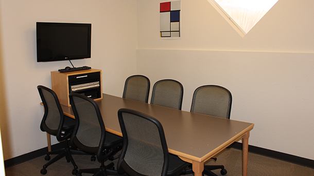 study room with table, chairs, and computer