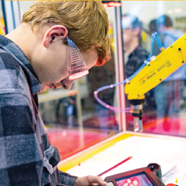 Student working on an automobile