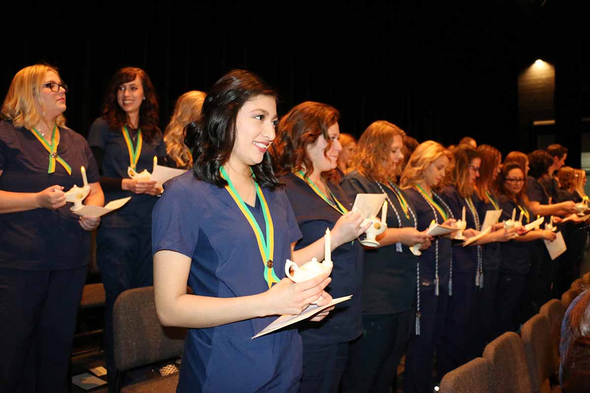 YC Nursing program graduates undergo the pinning ceremony at the Yavapai College Performing Arts Center