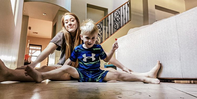 Sophomore Kennedy Wright trains at home with her little brother