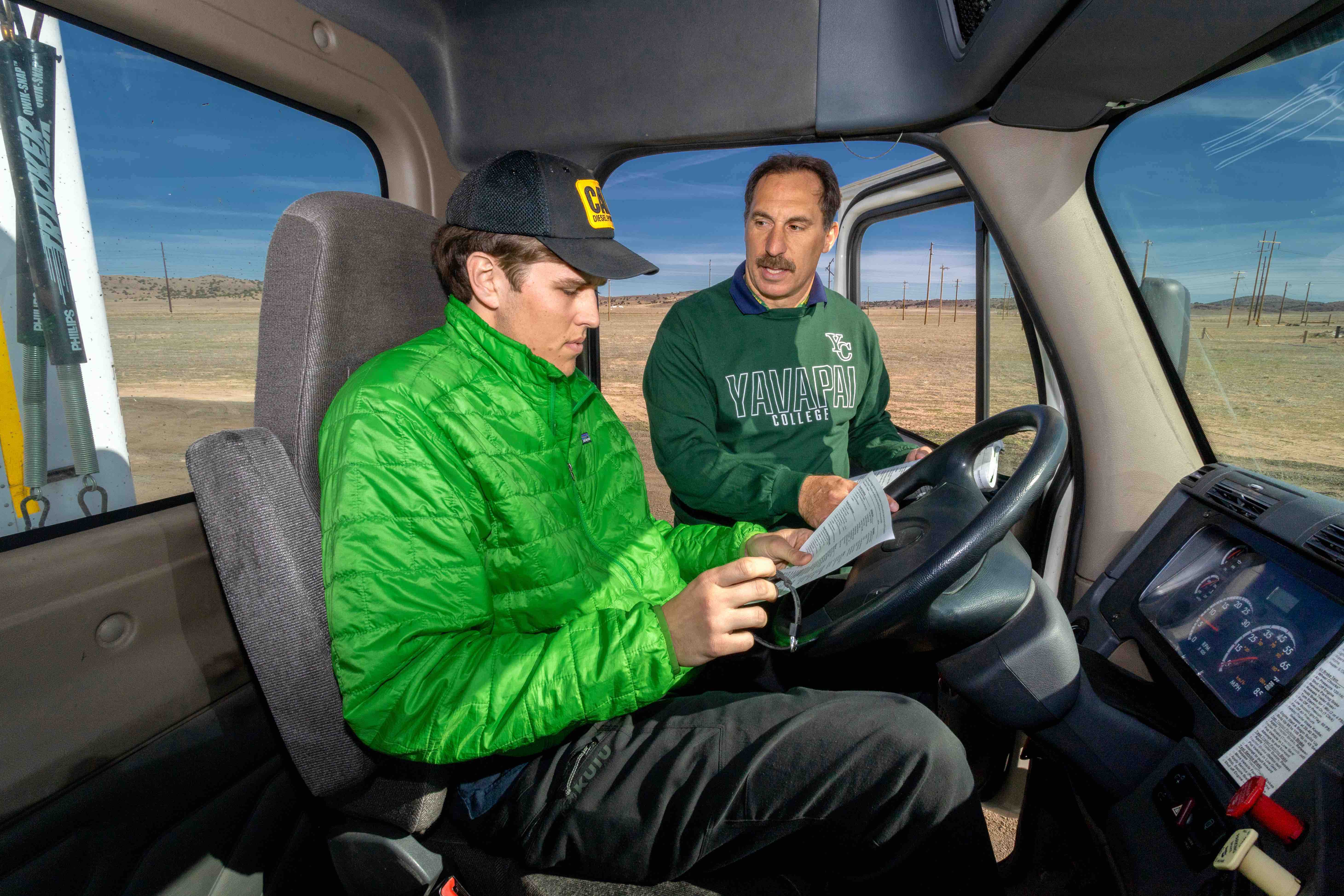 Student behind the wheel of a big rig