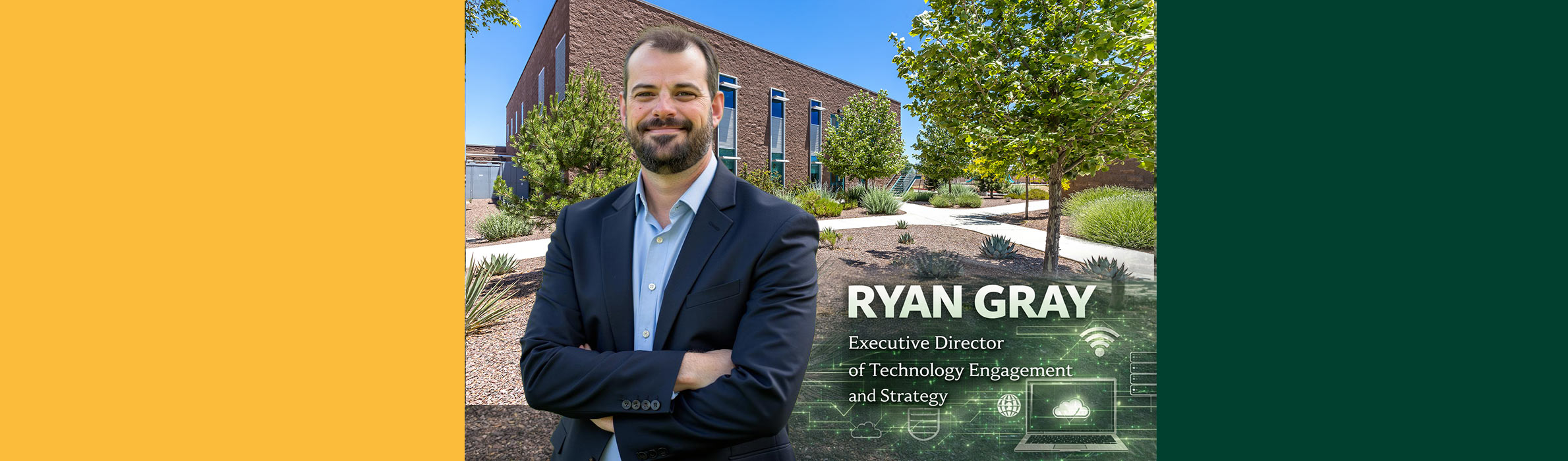 Ryan Gray standing on the campus under a tree