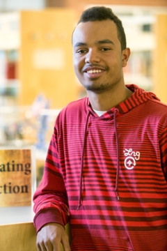 student in red shirt