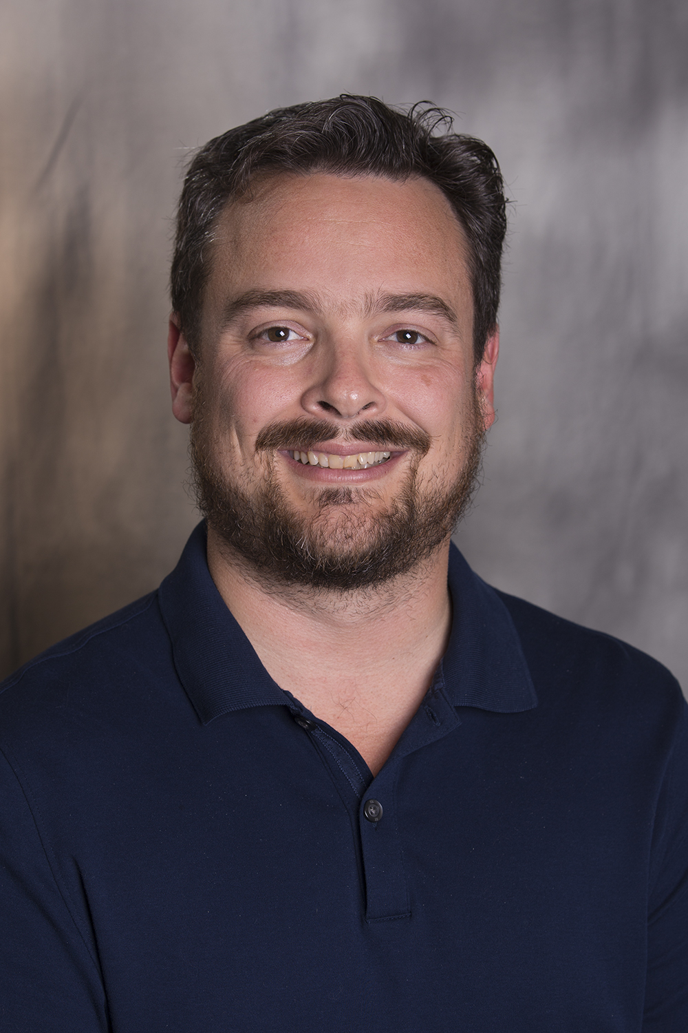 photo of smiling Aaron Kraft